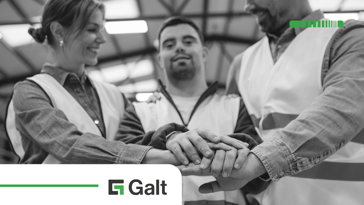 Three people in safety vests form a group huddle, stacking their hands together; the Galt logo is at the bottom.